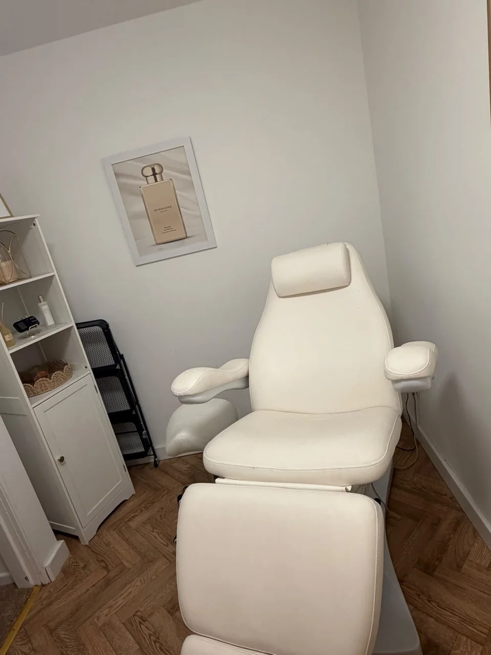 Cream treatment chair and shelving in Shania’s room at Ayda’s Beauty and Wellness